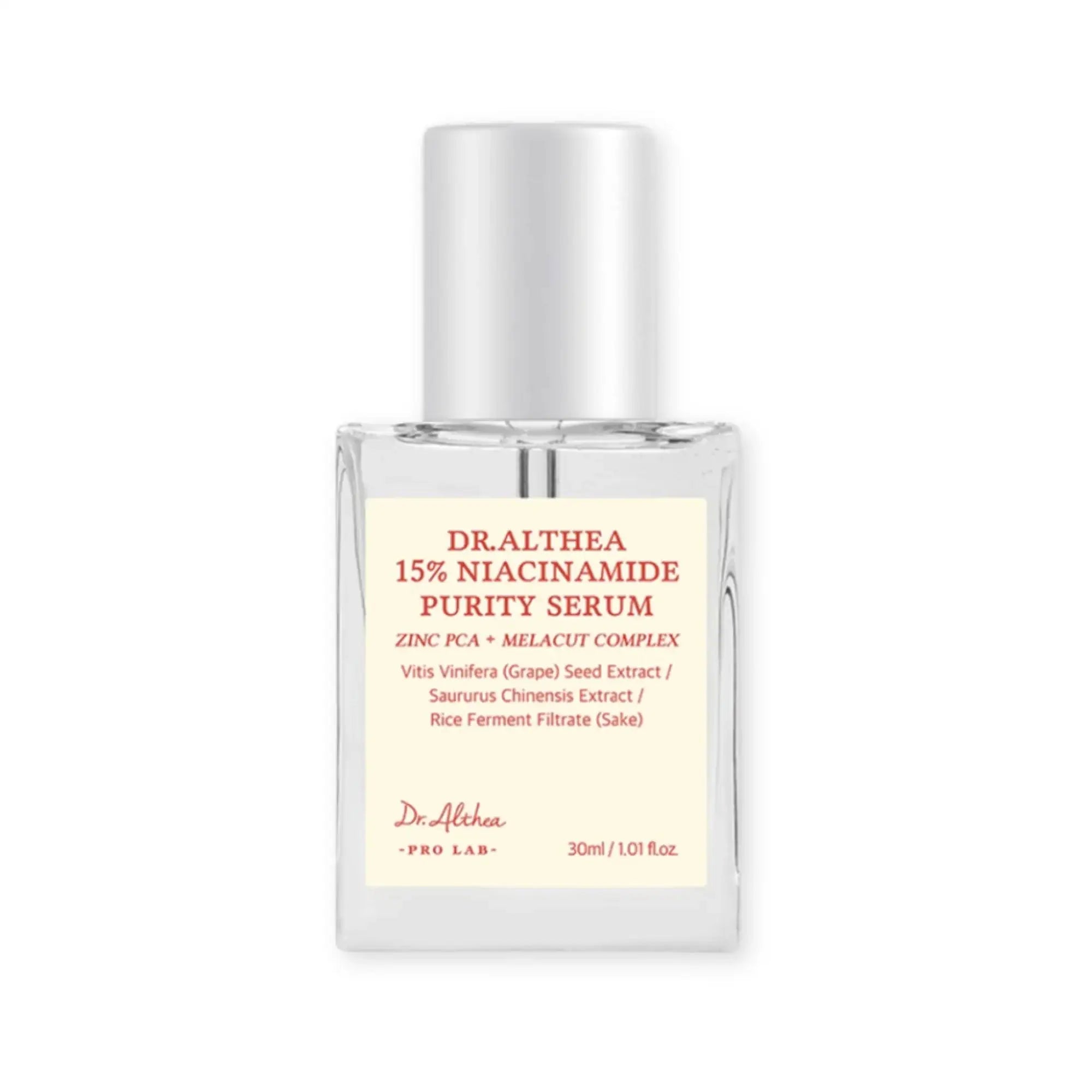 Niacinamide-serumfles met doorzichtige glazen verpakking en witte pomp, etiket op de voorzijde.