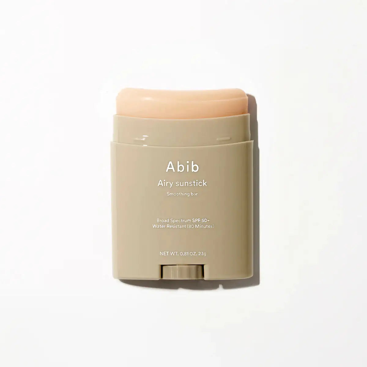Abib Airy Sunstick Smoothing Bar Zonbeschermingsstick in peach en crème verpakking, gladde opbouw met deksel