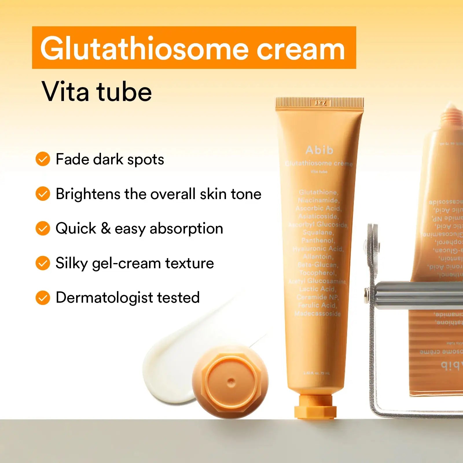 Abib Glutathiosome dark spot cream Vita tube Oranje glutathiosome-crèmetube met romige crème op ronde lepel