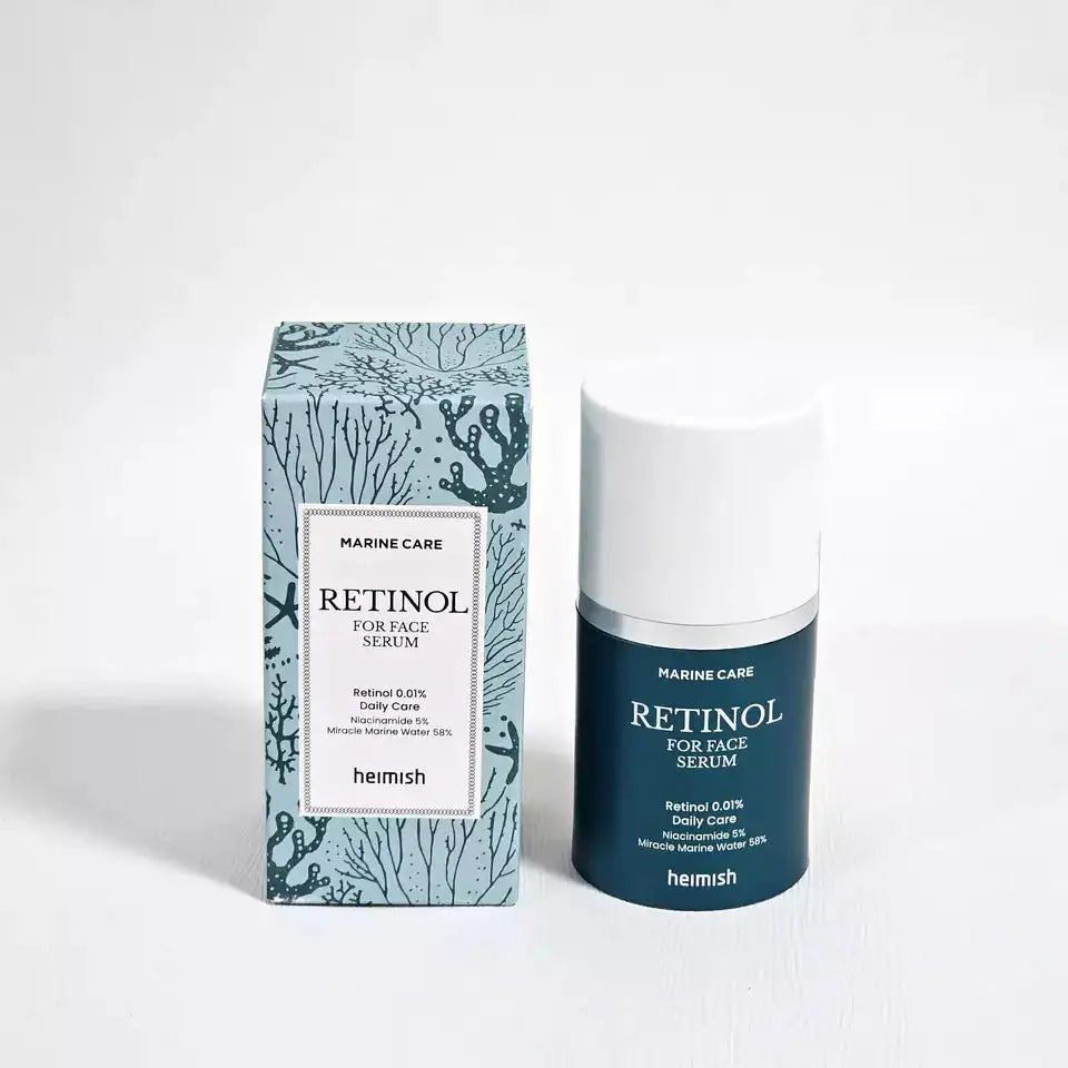 Retinol-gezichtsserum, donkerblauwe fles met witte dop en kartonnen doos Marine Care