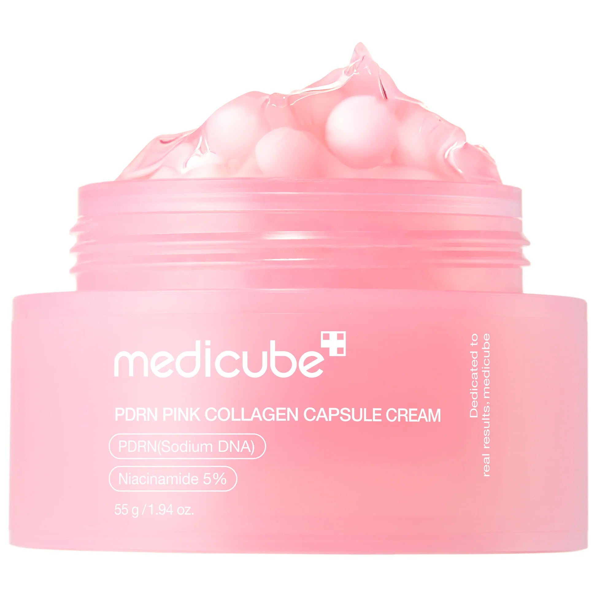 Roze capsulecrème pot met opgeschoven deksel en capsulebubbels bovenop