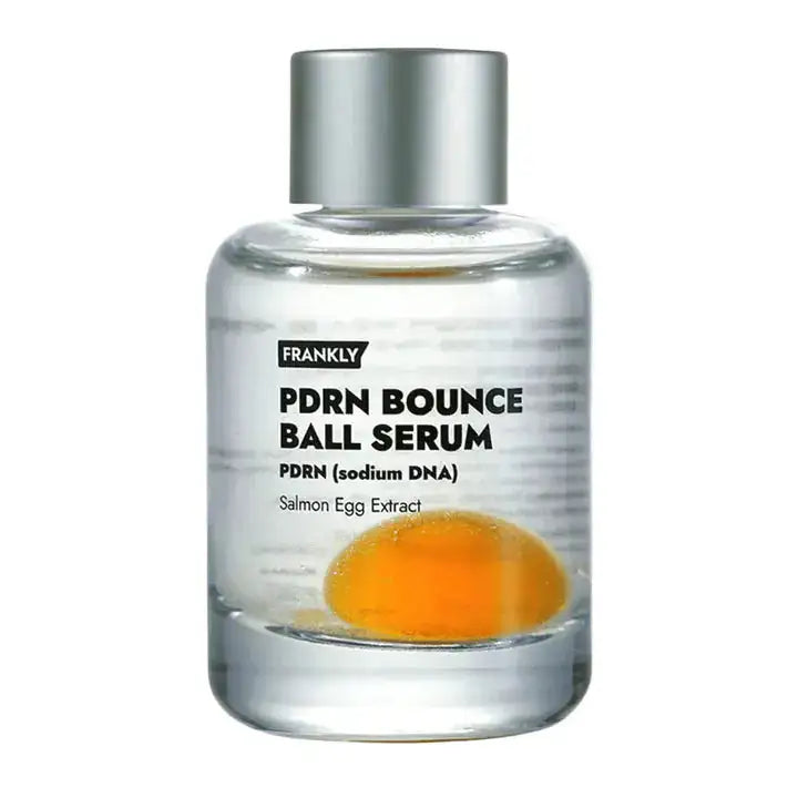 FRANKLY PDRN Bounce Ball Serum Serumfles met zilverkleurige dop en oranje vloeistof in doorzichtig flesje