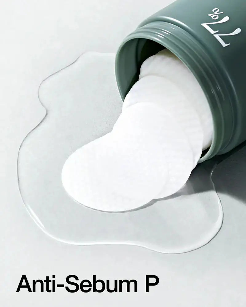Anua Heartleaf 77% Clear Pad Heartleaf 77% clear pad, witte wattenschijf die uit de pot wordt getrokken