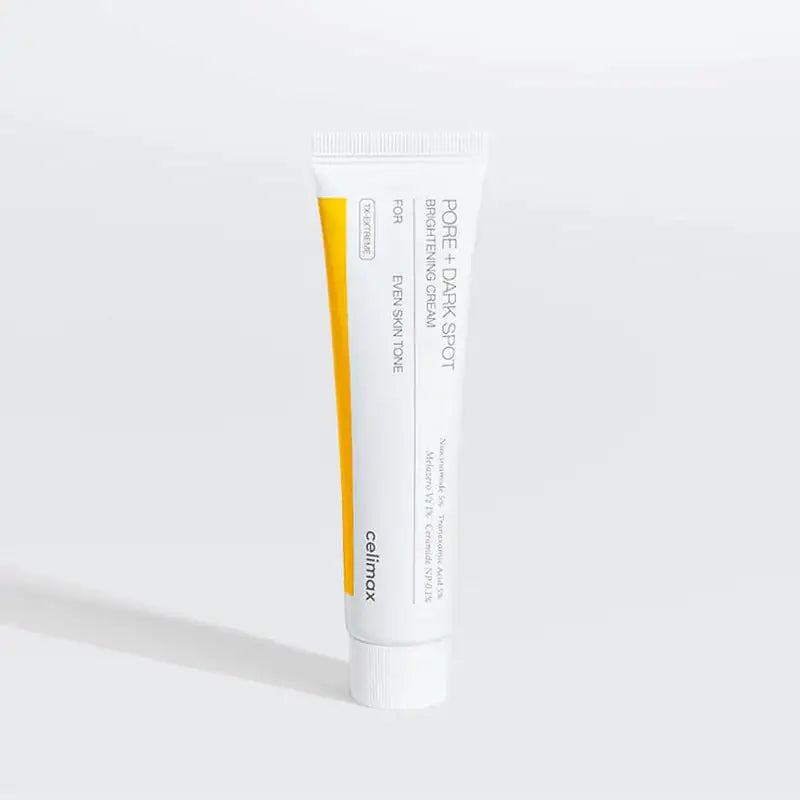 Pore+Dark Spot ophelderende crème tube, wit met gele accentstrip en dopje