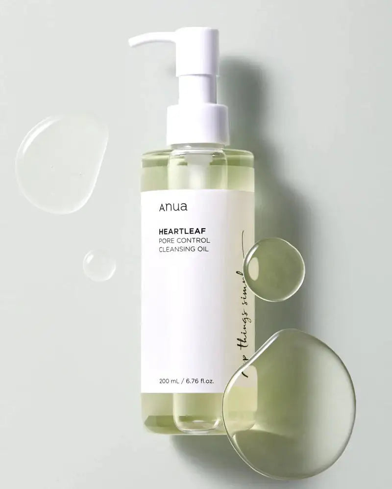 Anua Heartleaf Pore Control Cleansing Oil Anua heartleaf reinigingsolie met pomp en druppels op open deksel, 200 ml