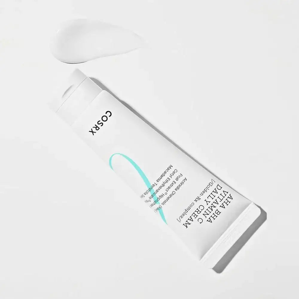 COSRX AHA/BHA vitamine C dagcrème tube op zij, witte knijpflacon