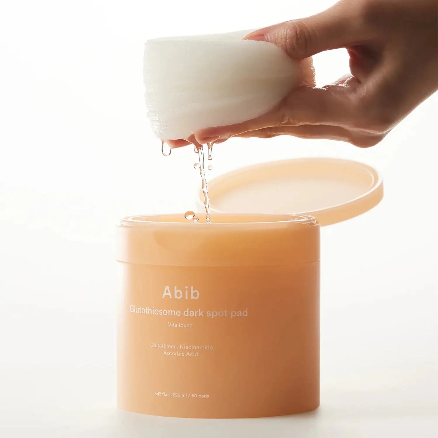 Abib Glutathiosome dark spot pad Vita touch Glutathiosome dark spotpads: geweekte pad uit pot, met serumdruppel