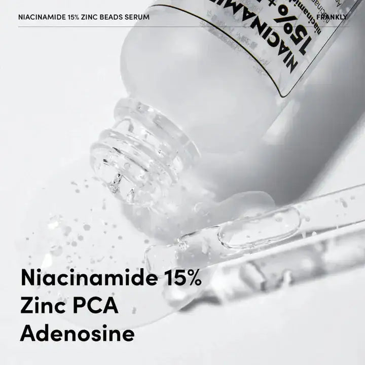 FRANKLY Niacinamide 15% Zinc Beads Serum Serum met niacinamide en zinkparels, doorzichtige druppels die uit fles stromen
