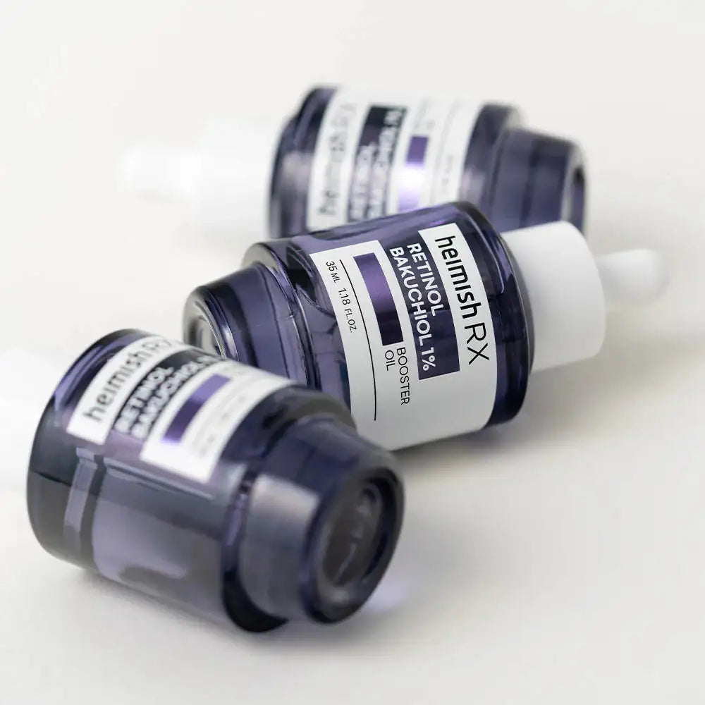 Druppelaarflessen met donkerblauw glazen pot en witte etiketten.