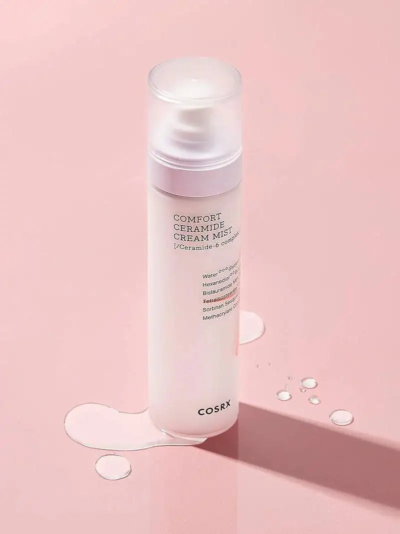 Ceramide crème-mistfles met ronde dop en druppels crème op oppervlak