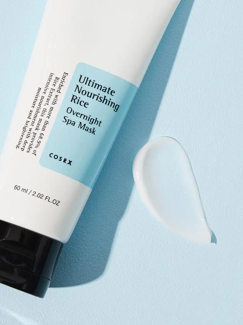 Rijstspa-masker tube met romige crème-druppel naast de tube