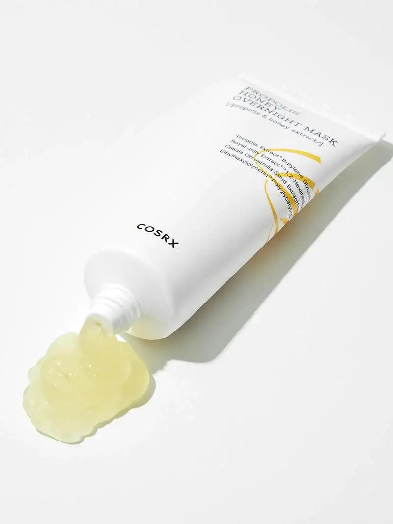Witte tube gezichtsmaske r met gele gel uit de opening, COSRX