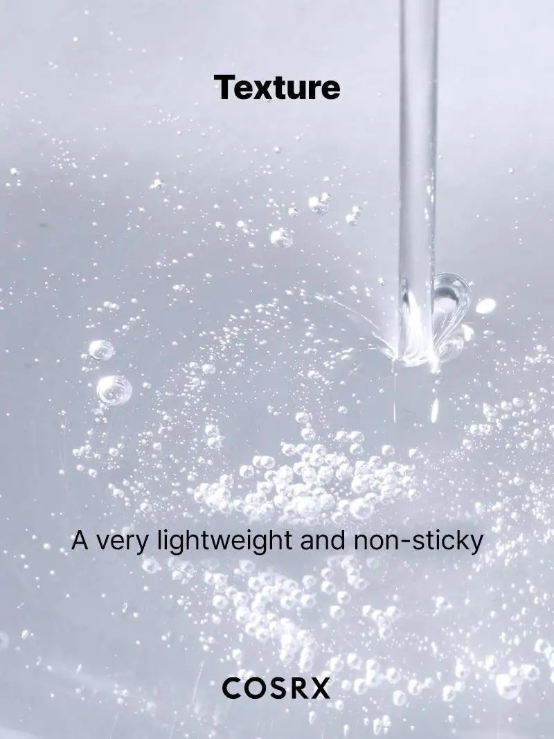 Niacinamide 15-serumtextuur uit druppelaar met zichtbare vloeistofspatten