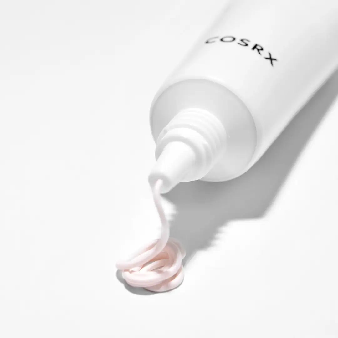 cosrx spotcrèmetube met uitgedrukte roze crème uit de tuit